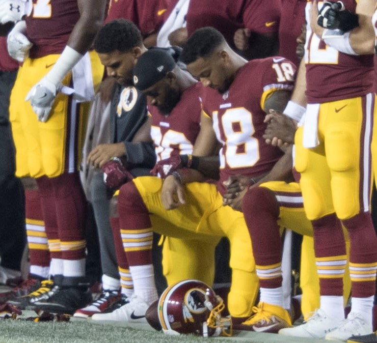 Players kneel for racial justice