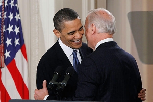 Vice President Biden congratulates President Obama for the signing of the Affordable Care Act.